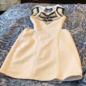 Black and white form fitted dress w/ cut out back